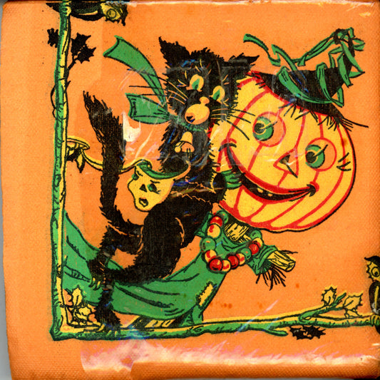 Vintage crepe paper luncheon napkins with a Halloween theme, featuring an orange background, black cat, scarecrow with a jack-o-lantern head, owls, bats, and masks.