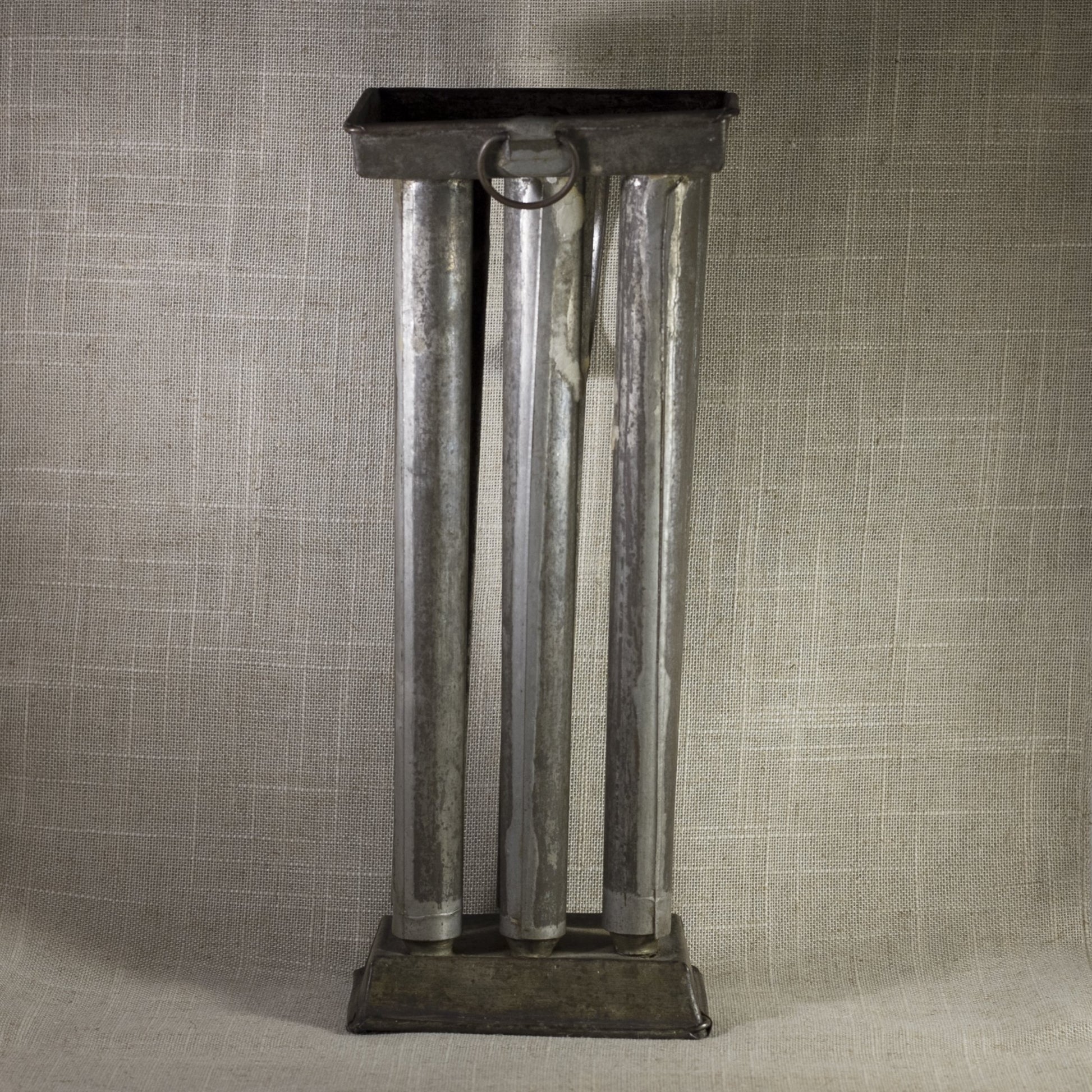 PRIMITIVE TIN SIX-CANDLE MOLD