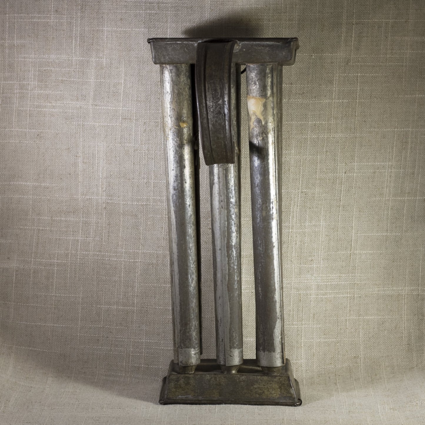 PRIMITIVE TIN SIX-CANDLE MOLD