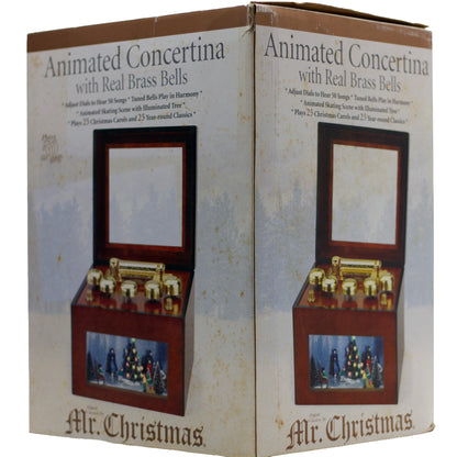 2006 Mr. Christmas Gold Label Animated Concertina with 50 songs, five real brass bells, animated skating scene, box, adapter and manual.