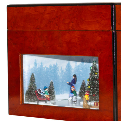 2006 Mr. Christmas Gold Label Animated Concertina with 50 songs, five real brass bells, animated skating scene, box, adapter and manual.