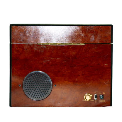 2006 Mr. Christmas Gold Label Animated Concertina with 50 songs, five real brass bells, animated skating scene, box, adapter and manual. Back with speaker box