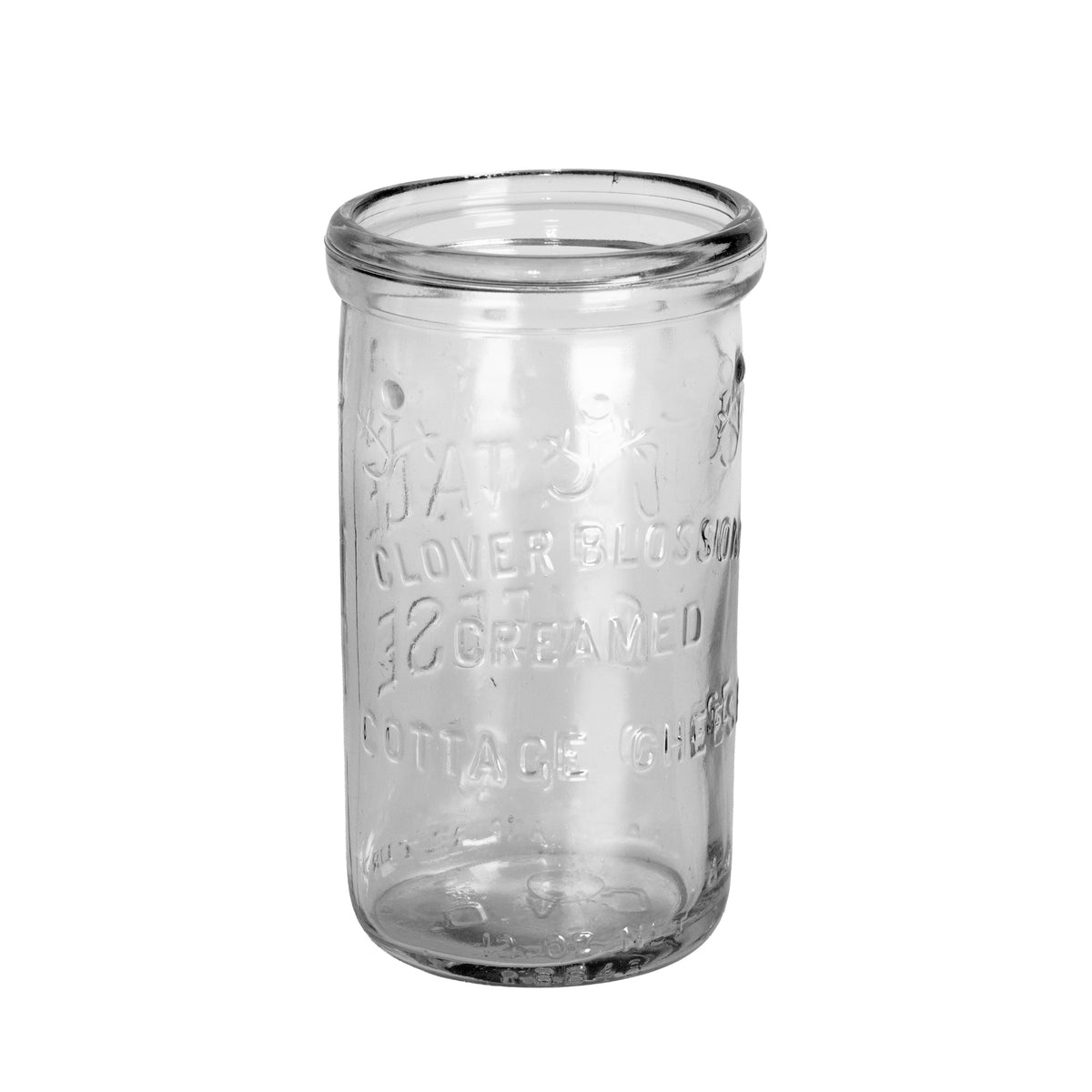 1948 Clover Blossom cottage cheese jar in clear Duraglas, made by Owens-Illinois. Embossed floral design, 12 oz net, no lid. Back view
