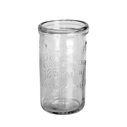 1948 Clover Blossom cottage cheese jar in clear Duraglas, made by Owens-Illinois. Embossed floral design, 12 oz net, no lid. Back view