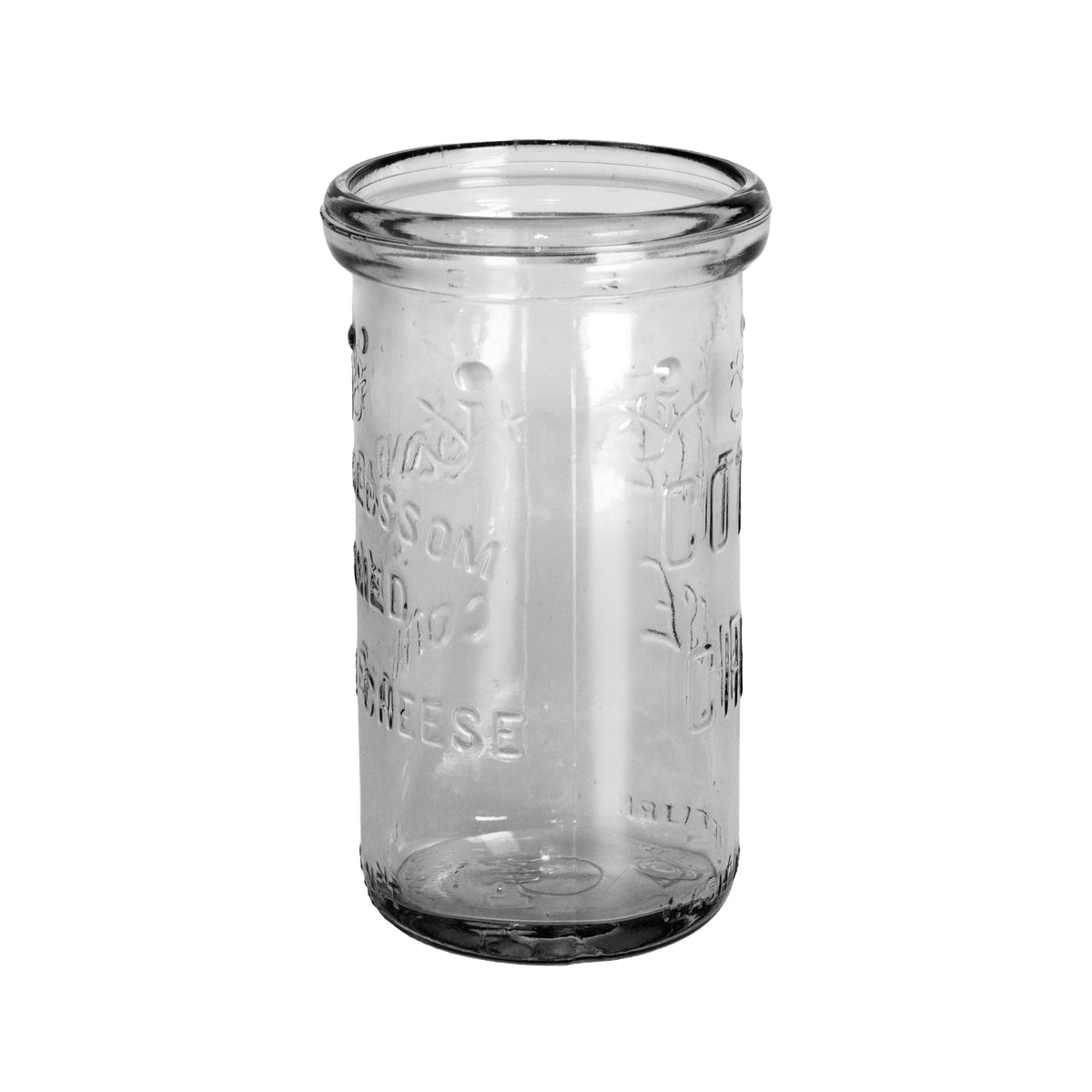 1948 Clover Blossom cottage cheese jar in clear Duraglas, made by Owens-Illinois. Embossed floral design, 12 oz net, no lid. Side view