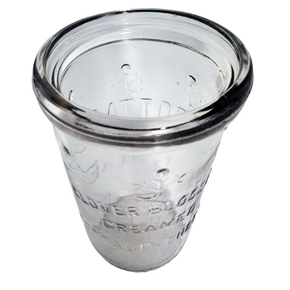 1948 Clover Blossom cottage cheese jar in clear Duraglas, made by Owens-Illinois. Embossed floral design, 12 oz net, no lid. Rim