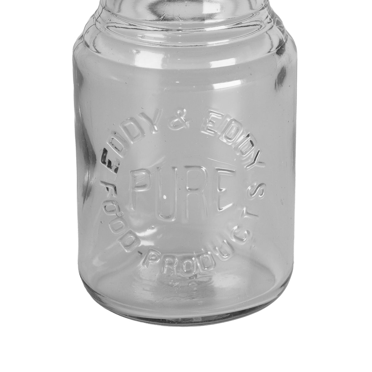 Early 1907–1912 Eddy & Eddy embossed Pure Food Products jar. St. Louis pantry glass with wide mouth and stepped neck. Charming antique display piece.