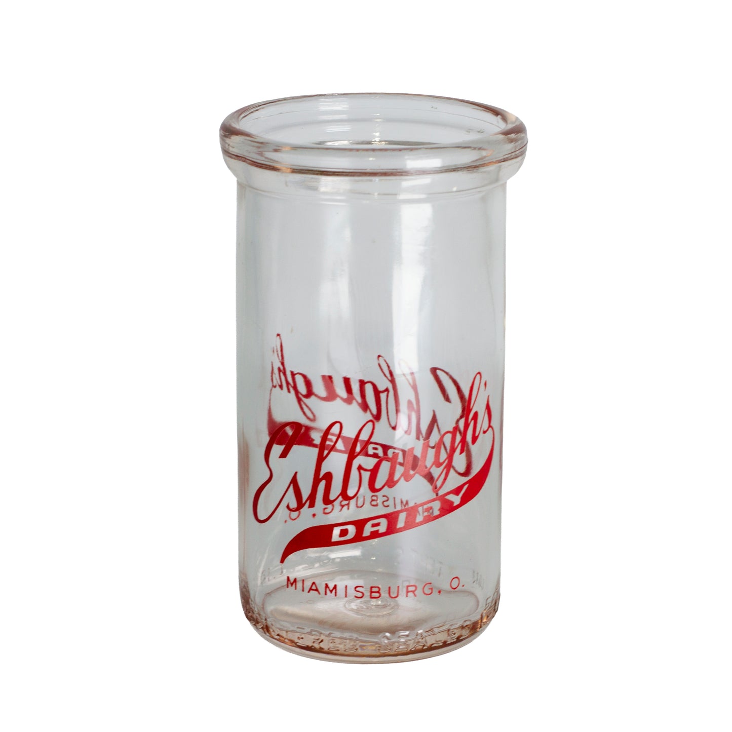 1940s Eshbaugh's Dairy glass jar from Miamisburg, Ohio. Red advertising, 12 oz capacity, and excellent vintage condition.