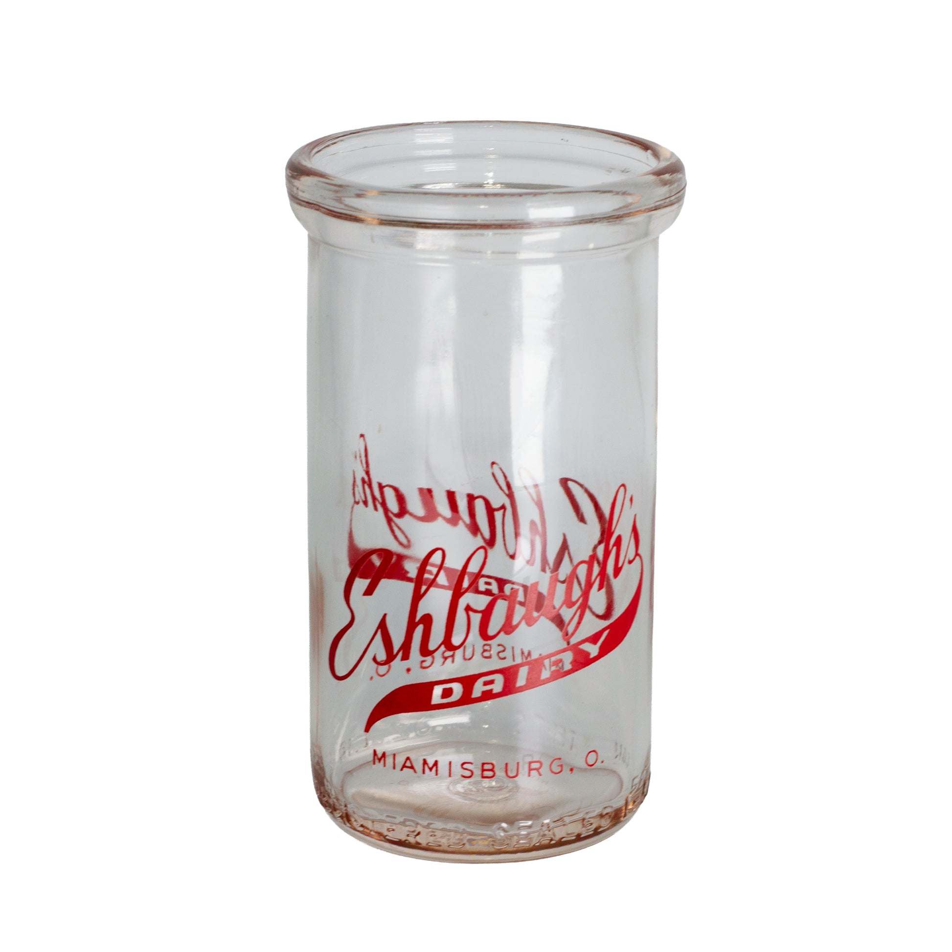 1940s Eshbaugh's Dairy glass jar from Miamisburg, Ohio. Red advertising, 12 oz capacity, and excellent vintage condition.