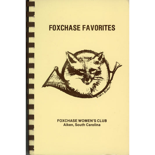 A vintage spiral-bound cookbook cover titled 'FOXCHASE FAVORITES' with a black fox illustration and the text 'FOXCHASE WOMEN'S CLUB Aiken, South Carolina' on a pale yellow background.