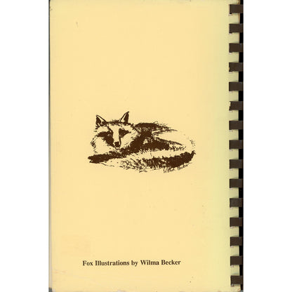 A vintage spiral-bound cookbook cover back for Foxcahse Cookbook featuring a black sketch of a sleeping fox and the text 'Fox Illustrations by Wilma Becker' at the bottom. The notebook is bound with a dark spiral on the right side.