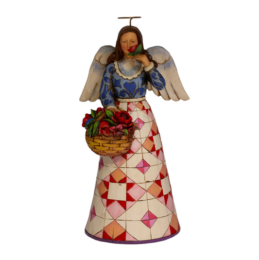 Jim Shore Heartwood Creek Smell The Flowers angel, 2007, item 4008943. Retired collectible with pink quilt skirt, floral basket, and original box.