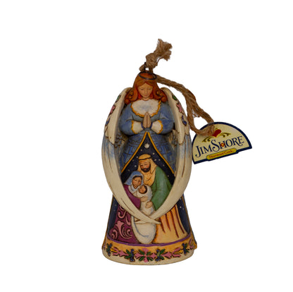 Early Jim Shore Heartwood Creek praying angel ornament with Nativity cloak. Rope hanger, approx. 4.5", c.2010–2012. Beautiful folk‑art Christmas collectible. Front
