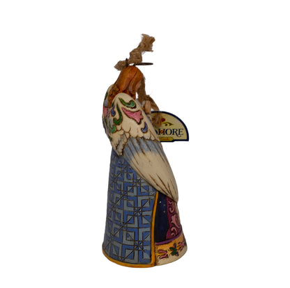 Early Jim Shore Heartwood Creek praying angel ornament with Nativity cloak. Rope hanger, approx. 4.5", c.2010–2012. Beautiful folk‑art Christmas collectible. Side view