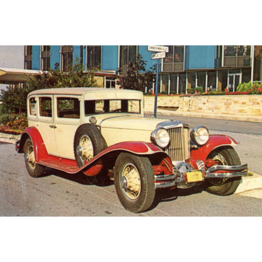 Vintage postcard featuring a 1930 Cord L‑29 four‑door Sports Sedan, issued for Automobilorama at Holiday West on U.S. 15 near the Pennsylvania Turnpike in Harrisburg, Pennsylvania. 