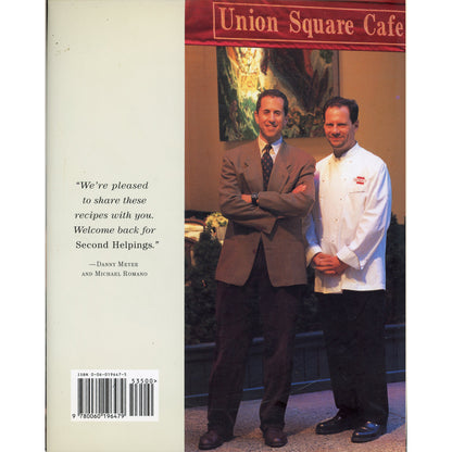 Back cover of a book titled 'Second Helpings from Union Square Cafe' showing a photo of Danny Meyer and Michael Romano.