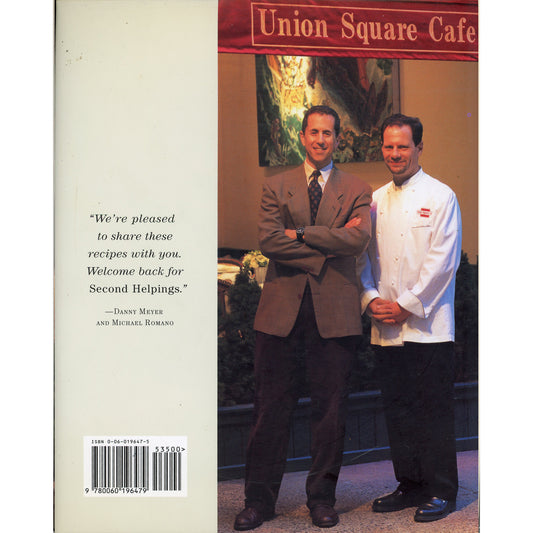 Back cover of a book titled 'Second Helpings from Union Square Cafe' showing a photo of Danny Meyer and Michael Romano.