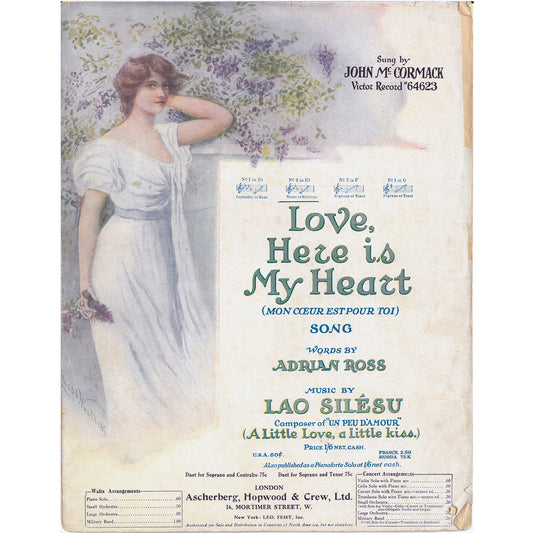 Sheet music cover for 'Love, Here is My Heart' with a woman in a white dress and floral background.