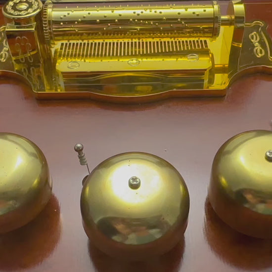 2006 Mr. Christmas Gold Label Animated Concertina with 50 songs, five real brass bells, animated skating scene, box, adapter and manual. VIDEO of 5 brass bells.