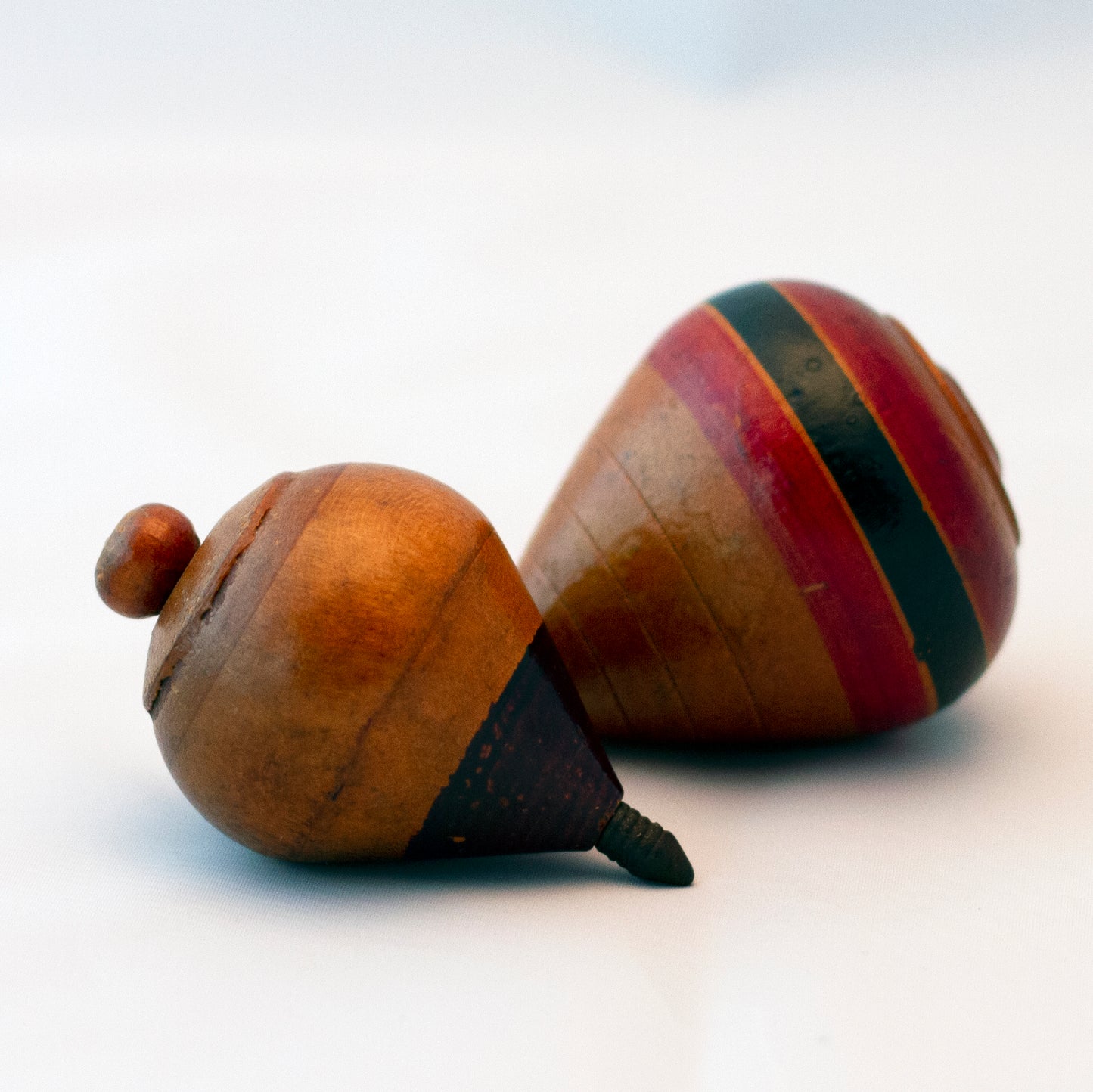 HAND PAINTED WOOD SPINNING TOPS Set of Two Circa 1930s to 1940s