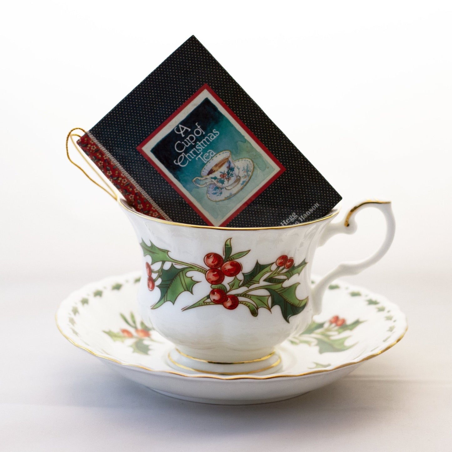 Waldman House “A CUP OF CHRISTMAS TEA” Footed Teacup and Saucer with Matching Ornament Size Tom Hegg Book Circa 1992