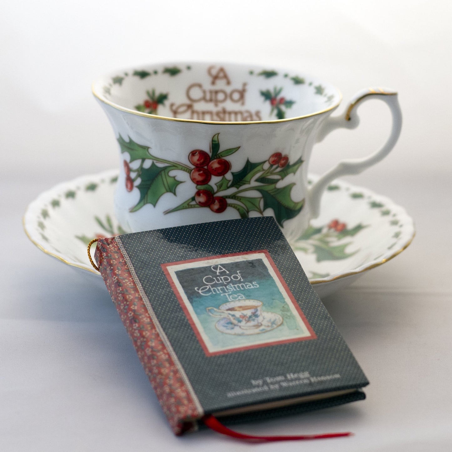 Waldman House “A CUP OF CHRISTMAS TEA” Footed Teacup and Saucer with Matching Ornament Size Tom Hegg Book Circa 1992