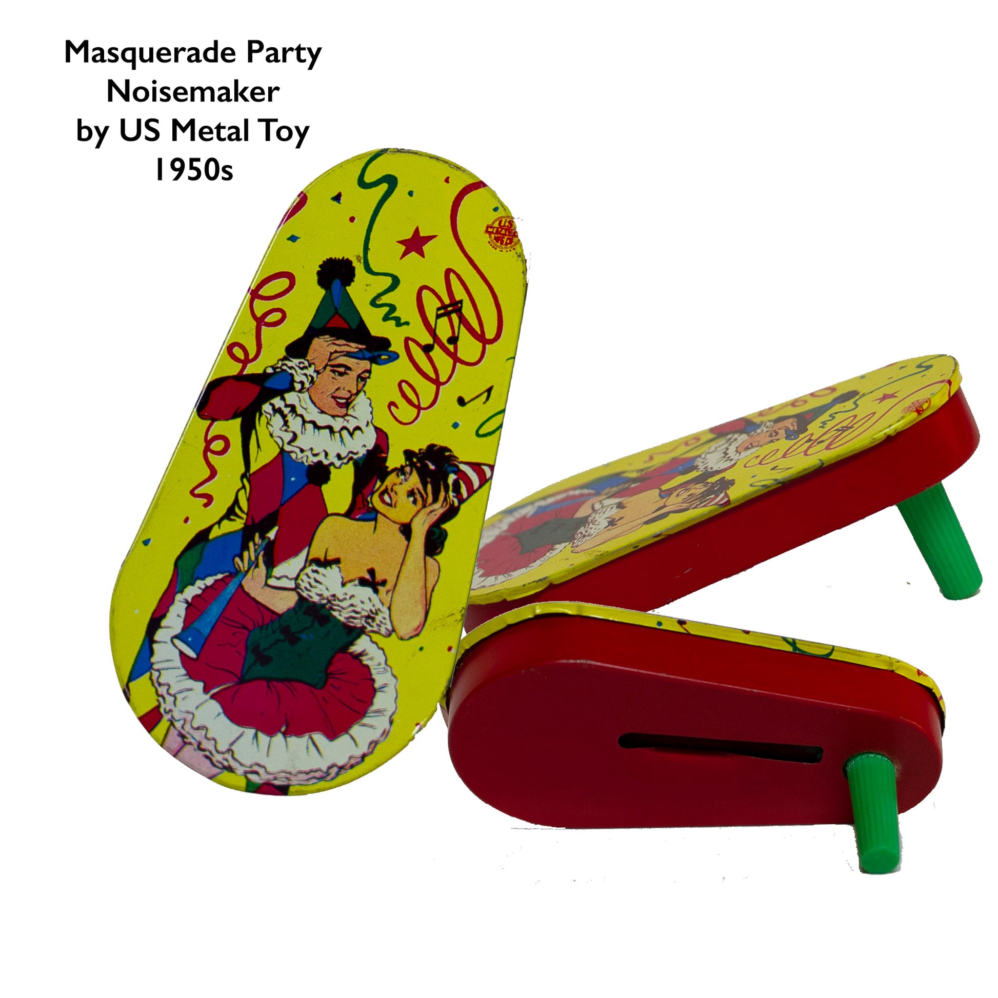 TIN-LITHOGRAPH RATCHET-STYLE MASQUERADE PARTY 1950s NOISEMAKER with green plastic handle by US Metal Toys depicting masquerade dressed couple; the man is dress in a harlequin print jester outfit and the woman in a short cha-cha dress. Lithograph is festive and bright; the background filled with streamers and confetti. 