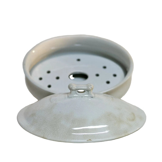 Gorgeous white antique IRONSTONE THREE-PIECE SOAP DISH made by MELLOR, TAYLOR AND COMPANY of Burslem Stoke-on-Tent in England. Set is in the shape of a small oval tureen and complete, including the drain and lid. Stamped dating the piece to between 1880-1904. Some staining, no chips.